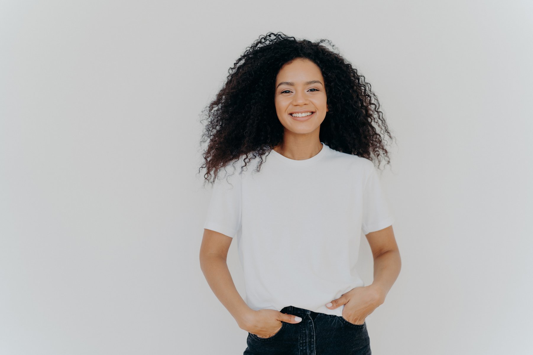 Isolated shot of young African American woman wears white t